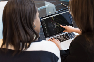 2 Women Looking at a Laptop Screen